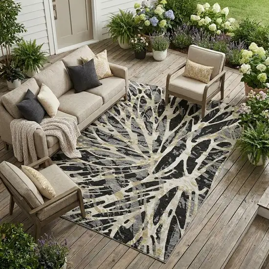 Black And Ivory Abstract Washable Indoor Outdoor Area Rug Photo 1
