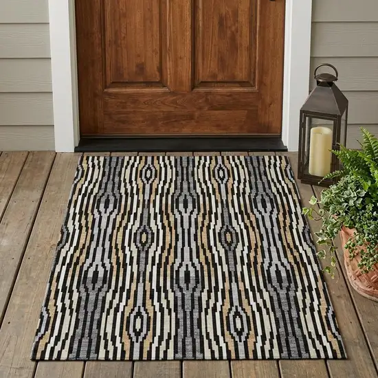 Black And Ivory Abstract Washable Indoor Outdoor Area Rug Photo 1