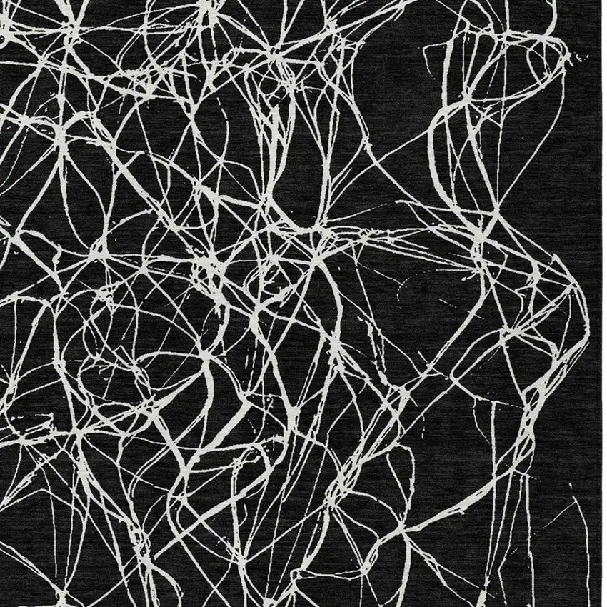 Black And Ivory Abstract Washable Indoor Outdoor Area Rug Photo 8