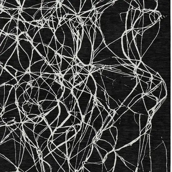 Black And Ivory Abstract Washable Indoor Outdoor Area Rug Photo 8