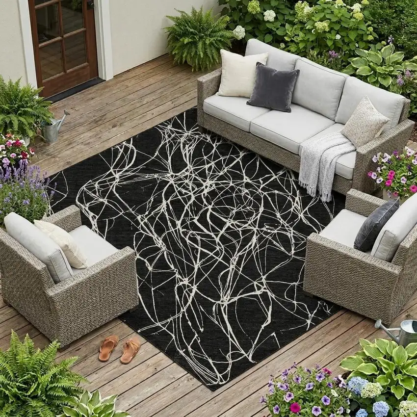Black And Ivory Abstract Washable Indoor Outdoor Area Rug Photo 1