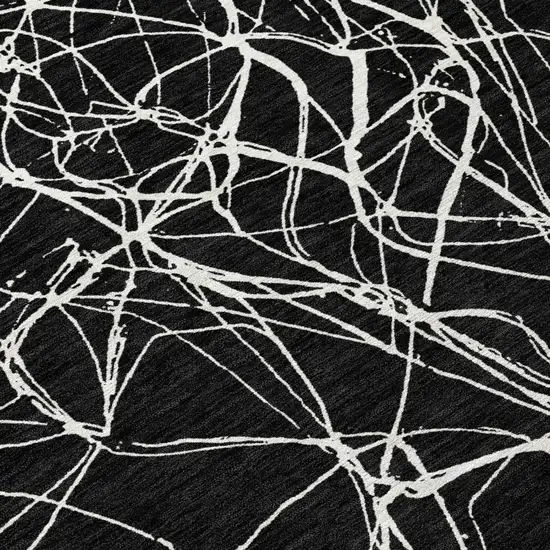 Black And Ivory Abstract Washable Indoor Outdoor Area Rug Photo 9