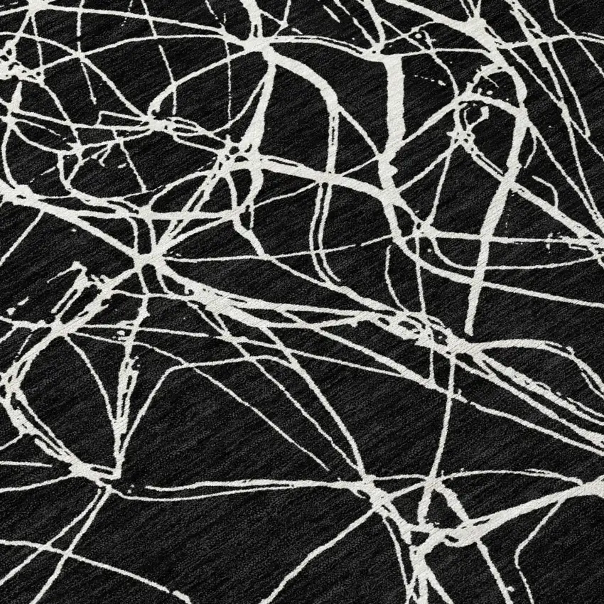 Black And Ivory Abstract Washable Indoor Outdoor Area Rug Photo 9