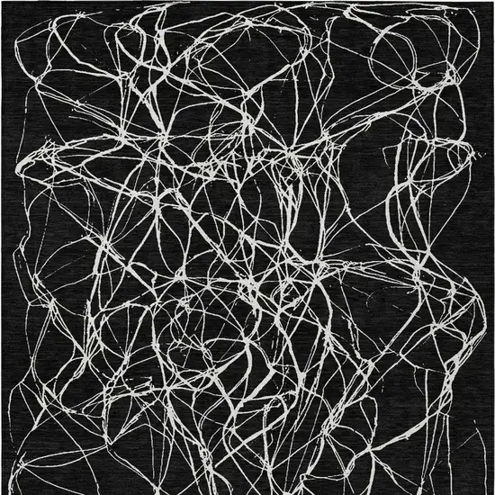 Black And Ivory Abstract Washable Indoor Outdoor Area Rug Photo 6