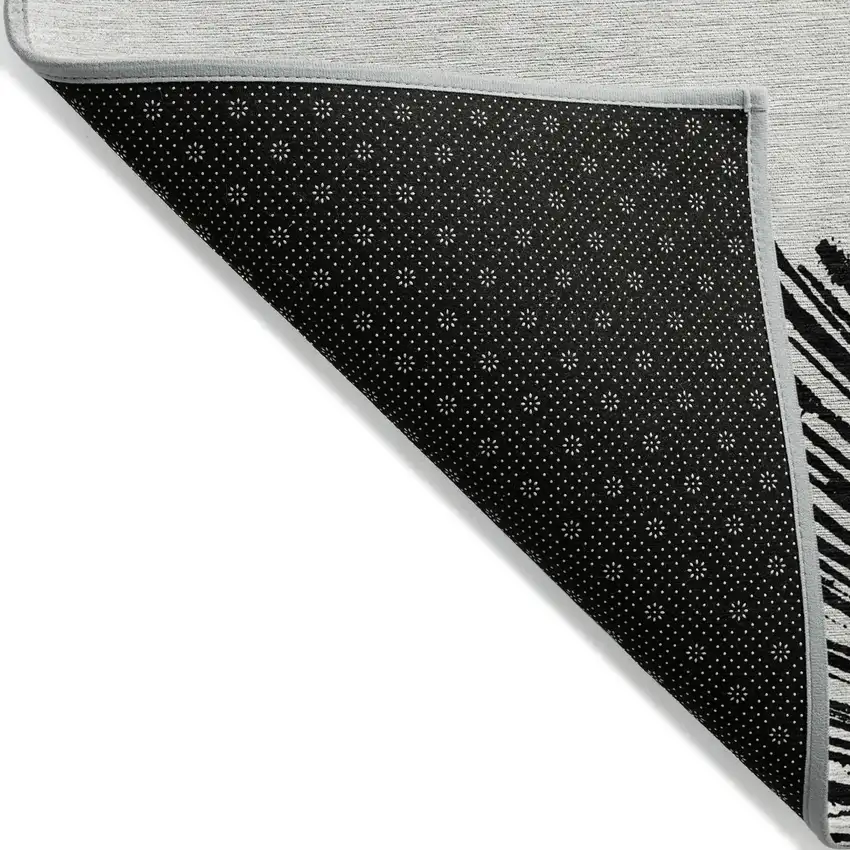 Black And Ivory Abstract Washable Indoor Outdoor Area Rug Photo 4