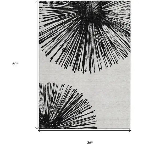 Black And Ivory Abstract Washable Indoor Outdoor Area Rug Photo 3