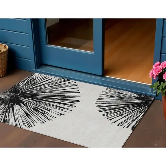 Black And Ivory Abstract Washable Indoor Outdoor Area Rug Photo 2