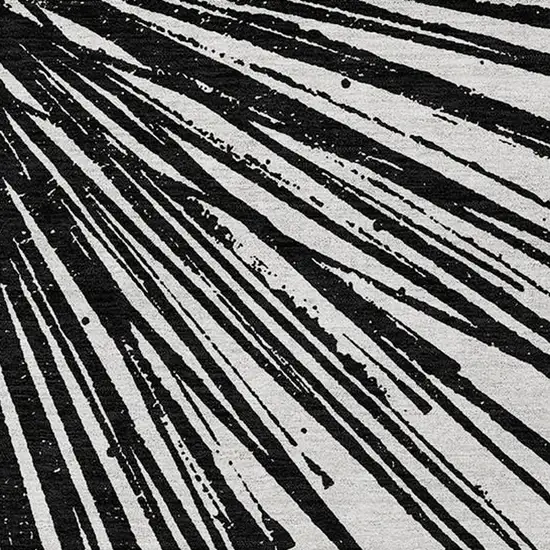 Black And Ivory Abstract Washable Indoor Outdoor Area Rug Photo 7