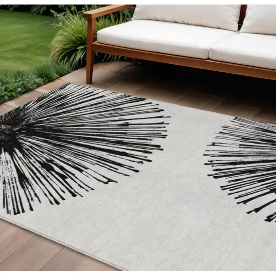 Black And Ivory Abstract Washable Indoor Outdoor Area Rug Photo 2