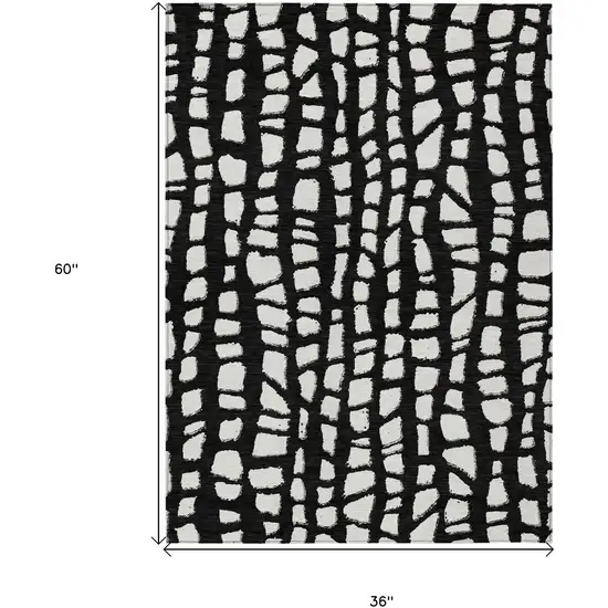 Black And Ivory Abstract Washable Indoor Outdoor Area Rug Photo 7