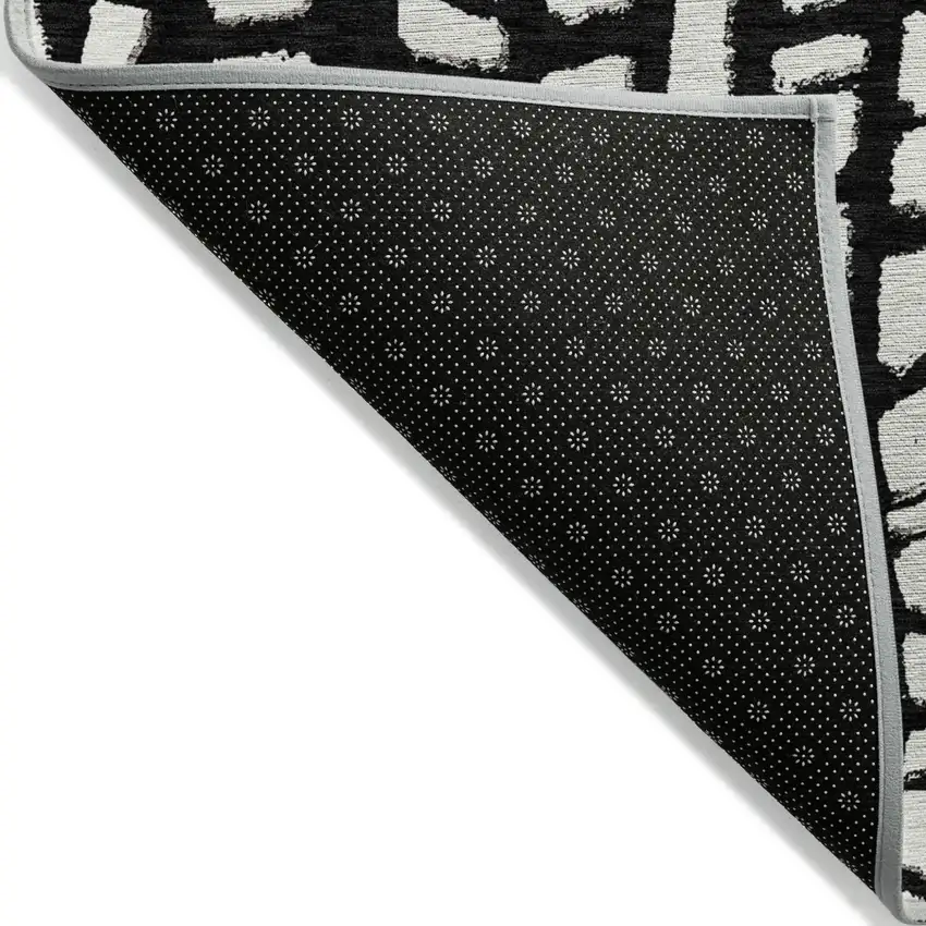 Black And Ivory Abstract Washable Indoor Outdoor Area Rug Photo 2