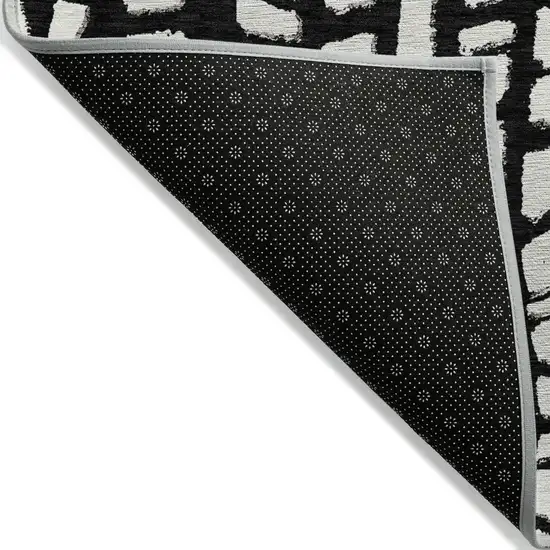 Black And Ivory Abstract Washable Indoor Outdoor Area Rug Photo 2