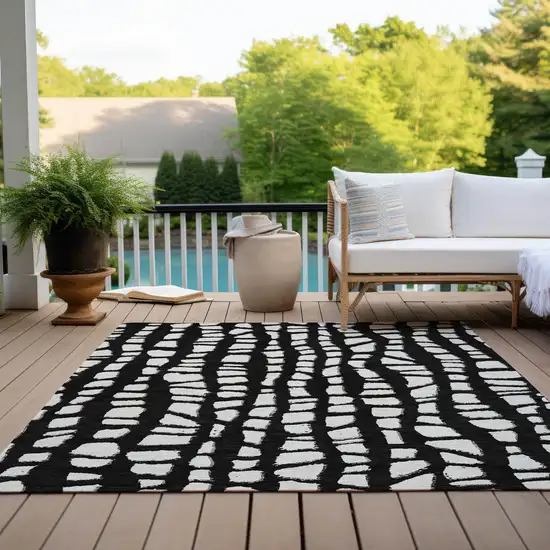 Black And Ivory Abstract Washable Indoor Outdoor Area Rug Photo 9