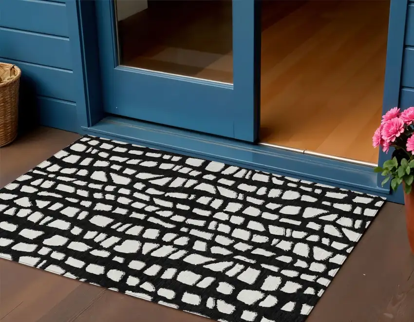 Black And Ivory Abstract Washable Indoor Outdoor Area Rug Photo 1