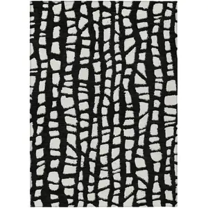 Photo of Black And Ivory Abstract Washable Indoor Outdoor Area Rug