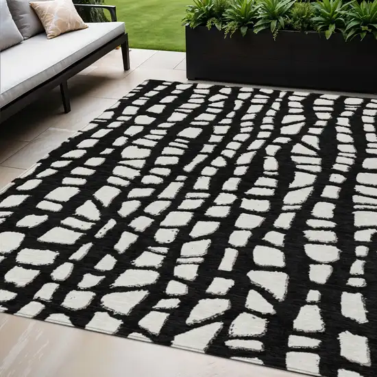 Black And Ivory Abstract Washable Indoor Outdoor Area Rug Photo 1