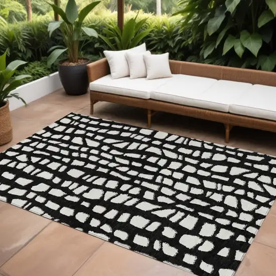 Black And Ivory Abstract Washable Indoor Outdoor Area Rug Photo 1