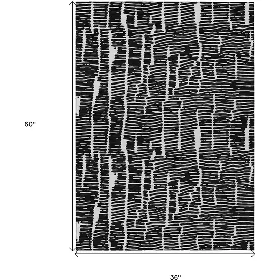 Black And Ivory Abstract Washable Indoor Outdoor Area Rug Photo 3