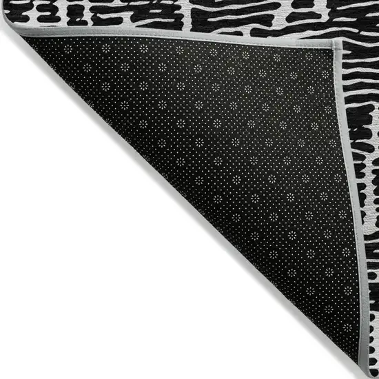 Black And Ivory Abstract Washable Indoor Outdoor Area Rug Photo 5
