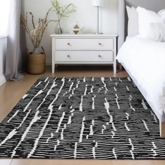 Black And Ivory Abstract Washable Indoor Outdoor Area Rug Photo 9