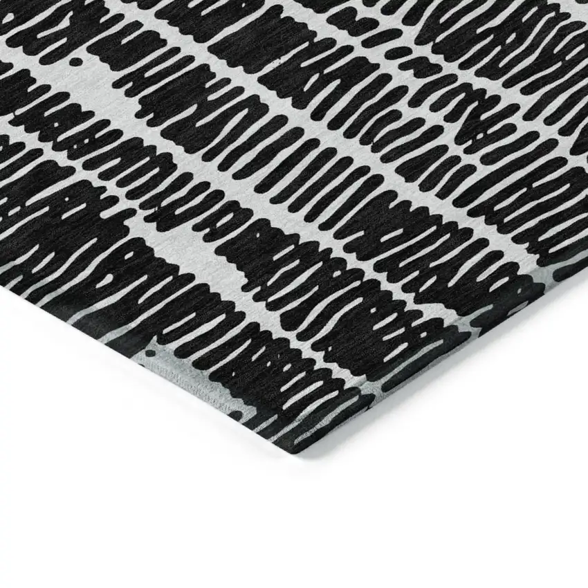 Black And Ivory Abstract Washable Indoor Outdoor Area Rug Photo 4