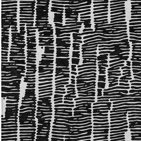 Black And Ivory Abstract Washable Indoor Outdoor Area Rug Photo 6