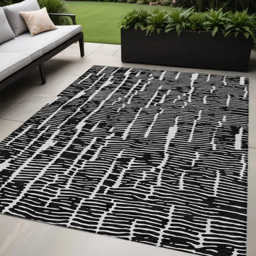 Black And Ivory Abstract Washable Indoor Outdoor Area Rug Photo 1