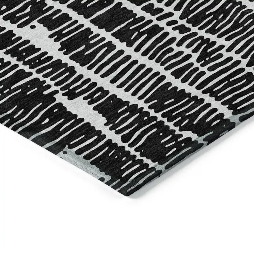 Black And Ivory Abstract Washable Indoor Outdoor Area Rug Photo 4