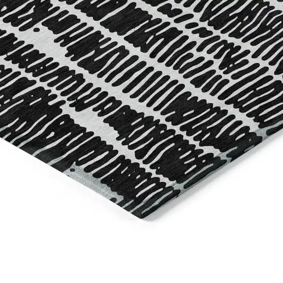 Black And Ivory Abstract Washable Indoor Outdoor Area Rug Photo 4