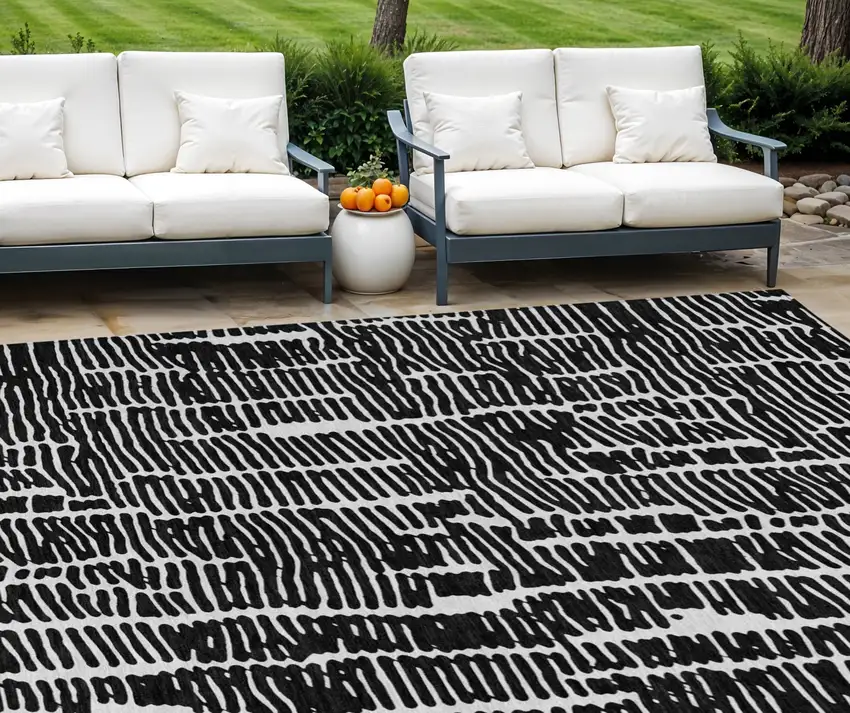 Black And Ivory Abstract Washable Indoor Outdoor Area Rug Photo 1