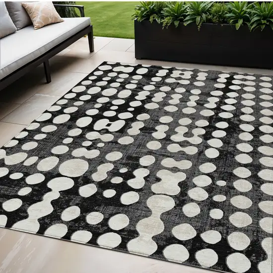 Black And Ivory Abstract Washable Indoor Outdoor Area Rug Photo 1