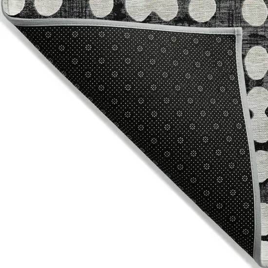 Black And Ivory Abstract Washable Indoor Outdoor Area Rug Photo 4