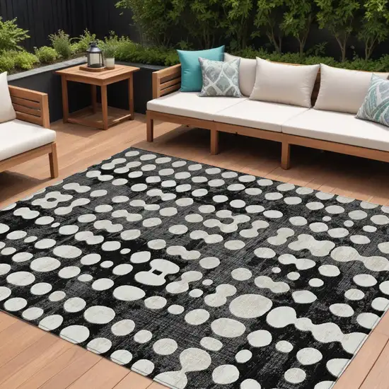 Black And Ivory Abstract Washable Indoor Outdoor Area Rug Photo 1