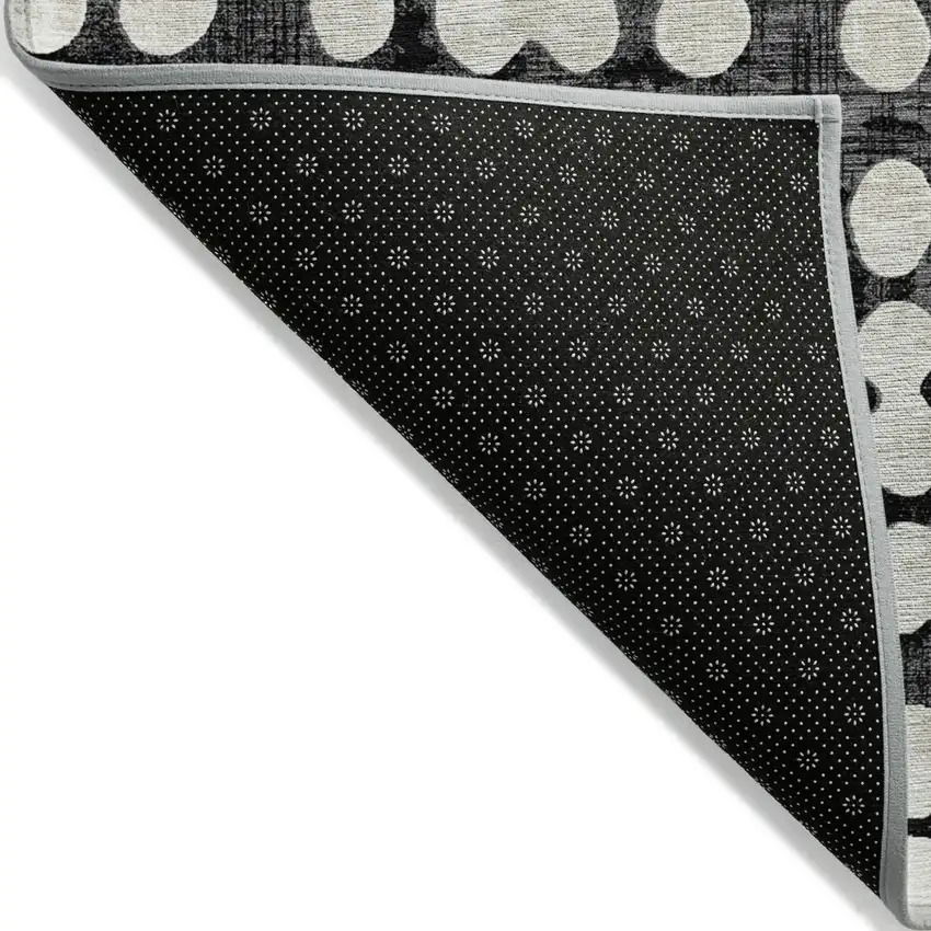 Black And Ivory Abstract Washable Indoor Outdoor Area Rug Photo 4