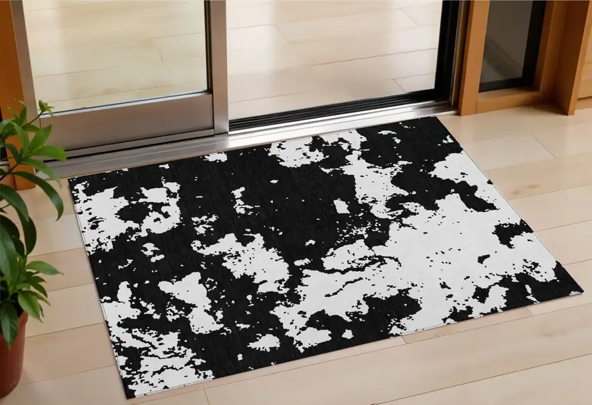 Black And Ivory Abstract Washable Indoor Outdoor Area Rug Photo 1