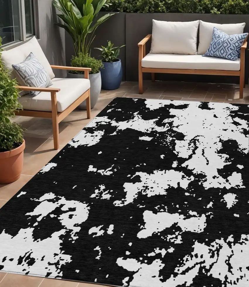 Black And Ivory Abstract Washable Indoor Outdoor Area Rug Photo 1