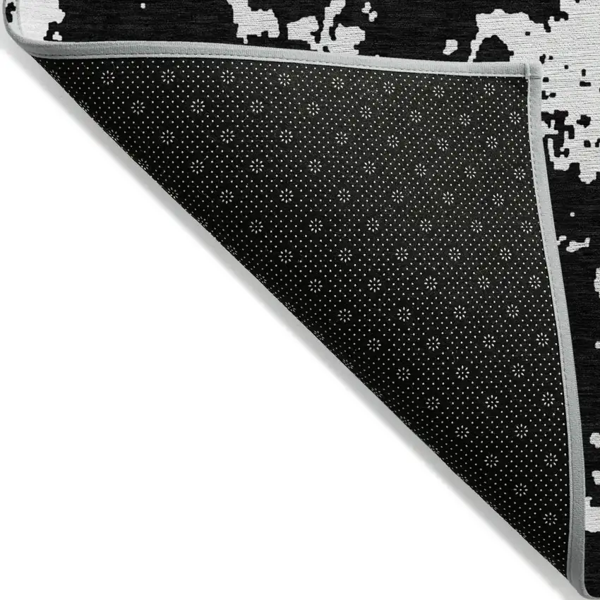 Black And Ivory Abstract Washable Indoor Outdoor Area Rug Photo 5