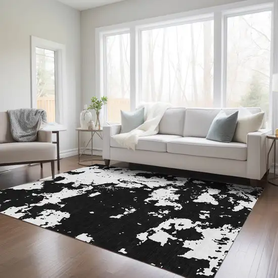 Black And Ivory Abstract Washable Indoor Outdoor Area Rug Photo 9