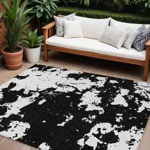 Photo of Black And Ivory Abstract Washable Indoor Outdoor Area Rug