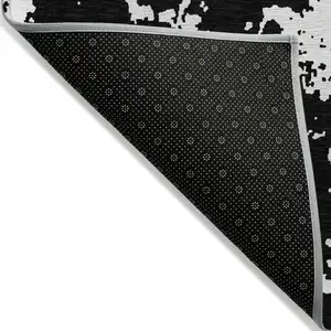 Photo of Black And Ivory Abstract Washable Indoor Outdoor Area Rug