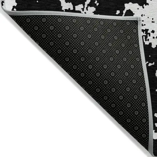 Black And Ivory Abstract Washable Indoor Outdoor Area Rug Photo 5