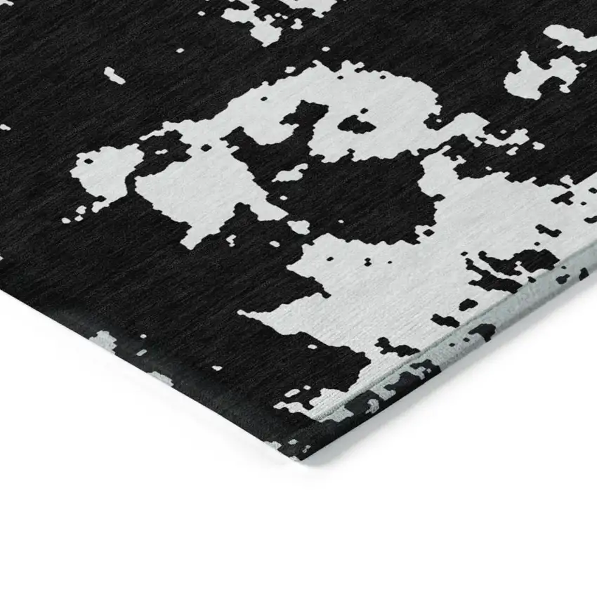 Black And Ivory Abstract Washable Indoor Outdoor Area Rug Photo 4