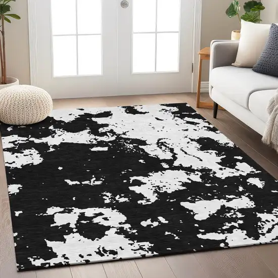 Black And Ivory Abstract Washable Indoor Outdoor Area Rug Photo 9