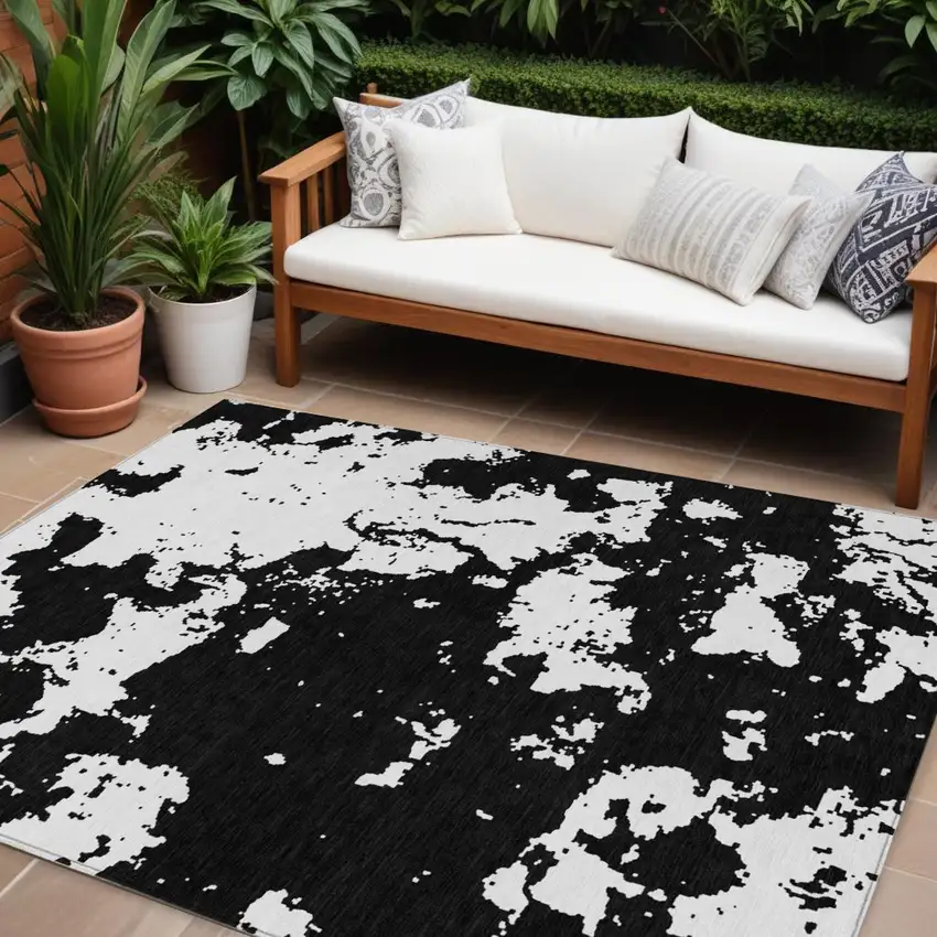 Black And Ivory Abstract Washable Indoor Outdoor Area Rug Photo 1