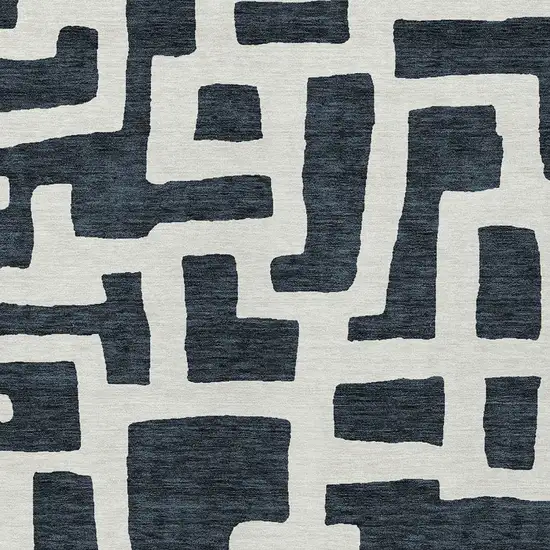 Black And Ivory Abstract Washable Indoor Outdoor Area Rug Photo 6