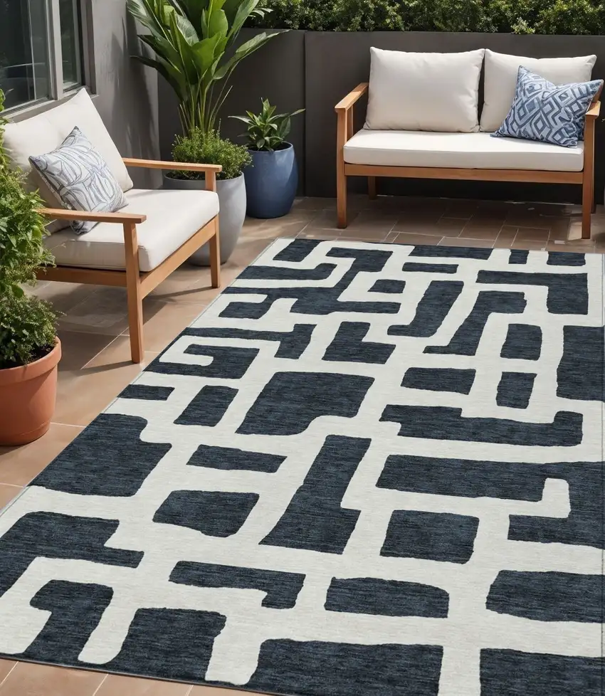 Black And Ivory Abstract Washable Indoor Outdoor Area Rug Photo 1