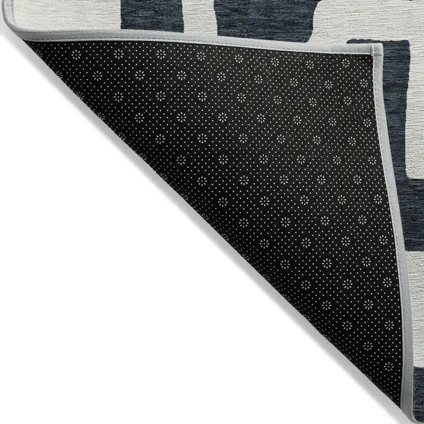 Black And Ivory Abstract Washable Indoor Outdoor Area Rug Photo 4