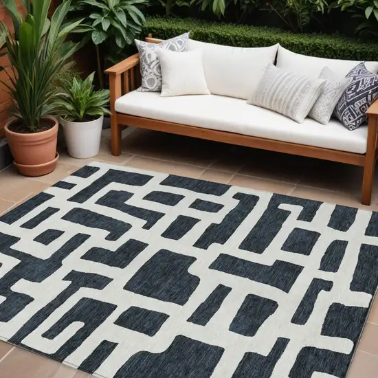 Black And Ivory Abstract Washable Indoor Outdoor Area Rug Photo 1
