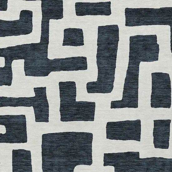 Black And Ivory Abstract Washable Indoor Outdoor Area Rug Photo 6