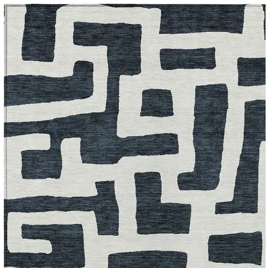 Black And Ivory Abstract Washable Indoor Outdoor Area Rug Photo 6